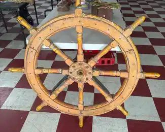 Nautical antique wood and cast iron ship's wheel.