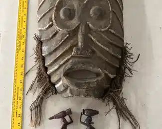 Huge antique mask and woodcarvings