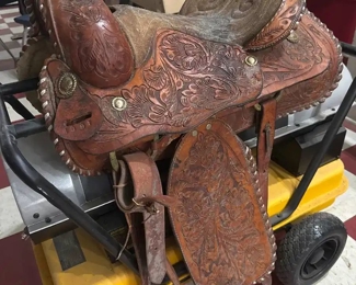 Fancy tooled leather saddle, looks like maybe Billy Cook or similar