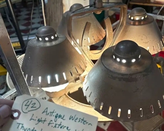 western light fixture with horseshoe, thunderbird, spur rowel
