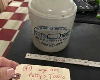 old red wing Petty's Tonic Hog Remedy jug