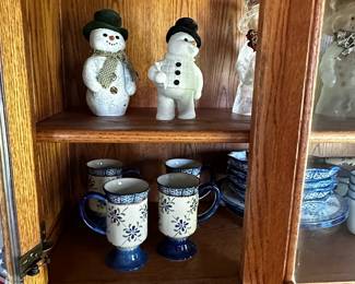 This is a beautiful Oak Hoosier Cabinet with a porcelain  counter! AND a small peek at a large Snowman collection!
