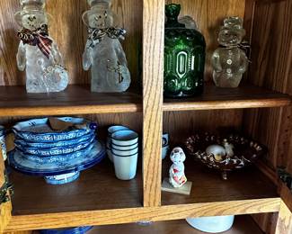 This is a beautiful Oak Hoosier Cabinet with a porcelain  counter! AND a small peek at a large Snowman collection!