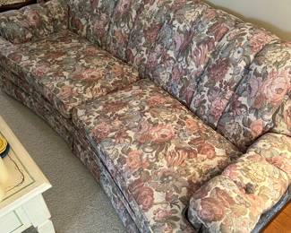 The couch in the living room looks near mint! Excellent condition! Table full of electric candles and candle accessories! 