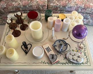 The couch in the living room looks near mint! Excellent condition! Table full of electric candles and candle accessories! 