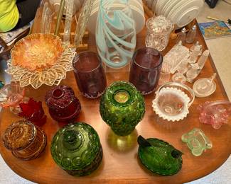 At the end of the table is great collection of Fenton Glassware! Fairy Glass Lamps, Chicken/Hen Nesting Candy Bowls, Multiple Wedding Baskets and a couple of Tulip Candle Holders! 