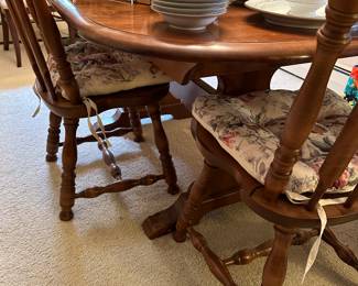 The dining room table is SOLID MAPLE and was produced bye E.R. BOCK! It comes with table leaves and four solid maple chairs! All the pieces are in near mint condition! The stain is called "SPICE"