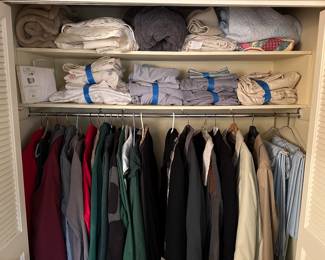 Here is a closet FILLED with Mens outerwear and above that are sheet sets, a MORE blankets/quilts! The sheet sets are Queen Size with a couple of twin sets thrown in! 