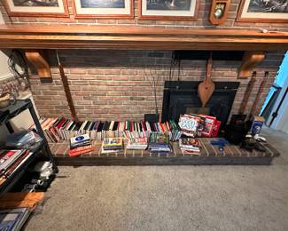 The hearth in the family room is home to DOZENS of cookbooks! New and Vintage - every possible cooing/baking subject is covered! 