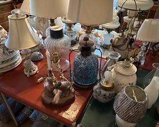 This is an electrifying picture of our collection of lamps! Lamps of ever sized shape and color! Vintage to contemporary, pairs to singles and LOTS of  lamp shades! 
