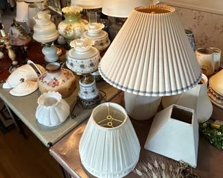 This is an electrifying picture of our collection of lamps! Lamps of ever sized shape and color! Vintage to contemporary, pairs to singles and LOTS of  lamp shades! 