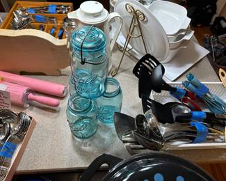 The kitchen island is a sea of great vintage kitchenware! 