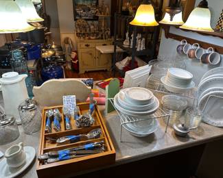 The kitchen island is a sea of great vintage kitchenware! 