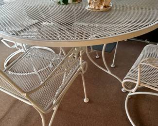 Lovely 5 piece wrought iron patio set! Table, 2 chairs and 2 rocker chairs! Excellent condition! 