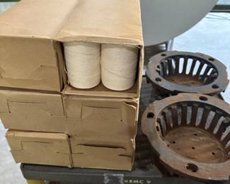 Cases of MINT IN THE ORIGINAL BOX TWINE! Also a pair of iron drain covers! 