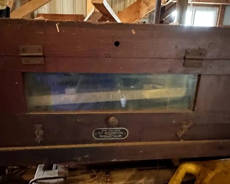 One of MANY AN TIQUE FARM MACHINES! They are stuffed everywhere! 