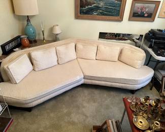 A superb MCM Corner couch! Heavy Cream colored fabric in excellent condition! Peeking out from behind it is an excellent corner table perfect for this piece!