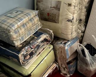 The linen room on the second floor of the house will be FILLED with all types of linen! Lots of vintage pieces to modern comforters in the bags you see above!