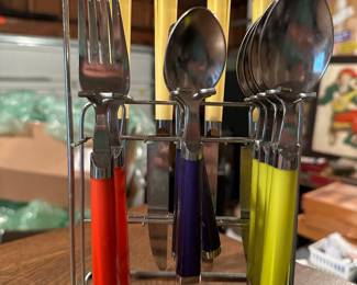 A lovely little set of flatware! I believe the handles are Bakelite!