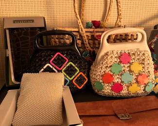 CLOSEUP! This is one of TWO shelving units filled with purses! They range from vintage to new, generic to name brand!