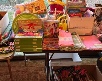 This is a huge election of Easter items! Decorations, egg coloring kits and whatnots! The box below the table is a ton of holiday paper goods! Napkins, table cloths etc...
