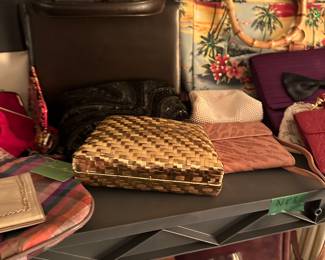 Closeup! This is one of TWO shelving units filled with purses! They range from vintage to new, generic to name brand!