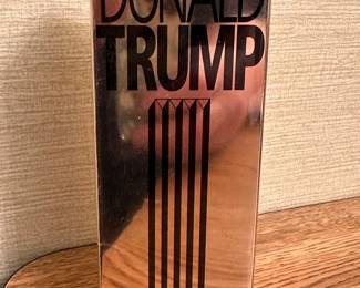 A wrapped unsealed MINT IN THE ORIGINAL PACKAGE of Donald Trump Eau De Toilette! 3.4 oz.