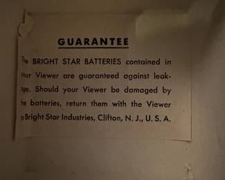 Here is a pair, in their original boxes, 35mm Slide Viewers! These are absolutely MCM! Both are red and black swirled Bakelite!