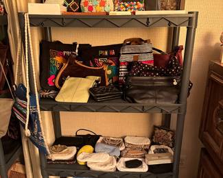 This is one of TWO shelving units filled with purses! They range from vintage to new, generic to name brand!