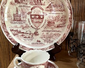 A small Vintage Collectible plate commemorating the 250th Anniversary of Detroit! At the bottom is a small tea cups and saucer with the same theme!