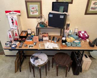 A shot of the dining room! Filled to the rim, displayed and ready for you to shop for treasures! Lots of great vintage items here in their original boxes! Singer 221 Featherweight, Jefferson Golden Hour Clock, and VERY high end perfume can be found on this table!