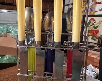 A lovely little set of flatware! I believe the handles are Bakelite!