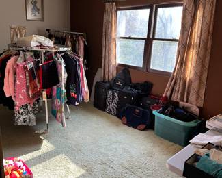 The last bedroom is displayed and ready to go. This is the room with mother load of Vintage clothing! The single rack in the back corner is a great place to start!