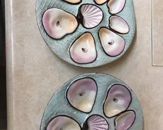 These Oyster Plates are rare. One has a hairline . Sold as found. Net design. 7 Oyster Wells.