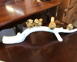 Little gold robins on a white tree branch