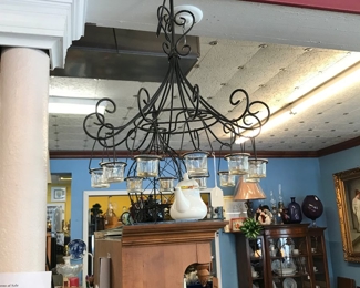Our metal Chandelier with hanging voltive cups