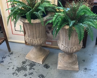 Heavy urns but not concrete. Comes with ferns