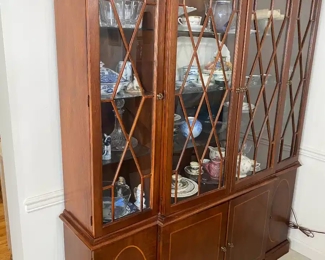 China cabinet full of collectibles 