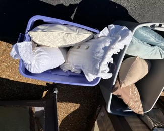 Several styles and colors of throw pillows