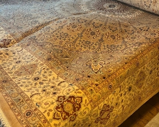 Very Large Beautiful Area Rug, Draped over a Queen Size Bed.