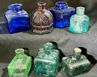 Vintage colored glass ink bottles