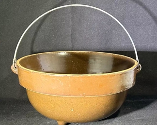 A rustic beauty- footed bowl with metal handle