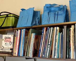 Calligraphy books and crafting project bags.