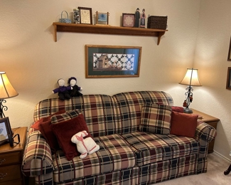 Classily upholstered in plaid sleeper sofa