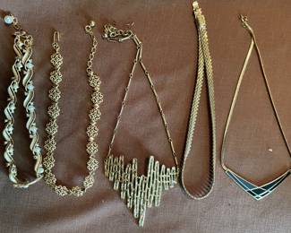 Lots of costume jewelry including the Sarah Coventry necklace in center