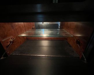 Bookcase on left has enclosed bar!