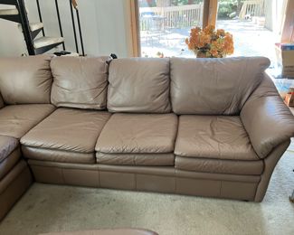 Leather sectional and matching ottoman. Sectional measures 86" x 74"W - 36"D - 33"H with a seat height of 18".   
