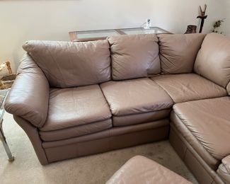Leather sectional and matching ottoman. Sectional measures 86" x 74"W - 36"D - 33"H with a seat height of 18".  