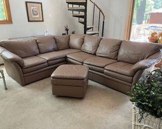 Leather sectional and matching ottoman. Sectional measures 86" x 74"W - 36"D - 33"H with a seat height of 18".   