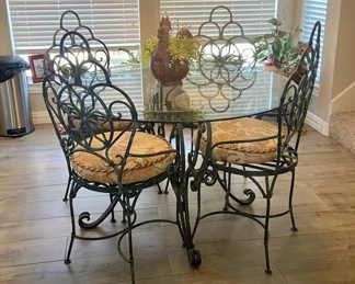 Wrought Iron Table with Glass top and 4 chairs